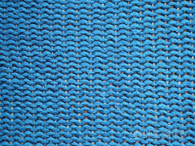 蓝色针织纹理的背景,编织与檩条环.照片-正版商用图片2a5ky6-摄图新视